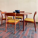 Stamped made in Denmark, the table is unique in that it opens side to side as opposed to end to end. When pulled apart it reveals a fold out butterfly leaf.  When the table is closed it is an oval shape but when open it’s more of a "square with rounded corners" 