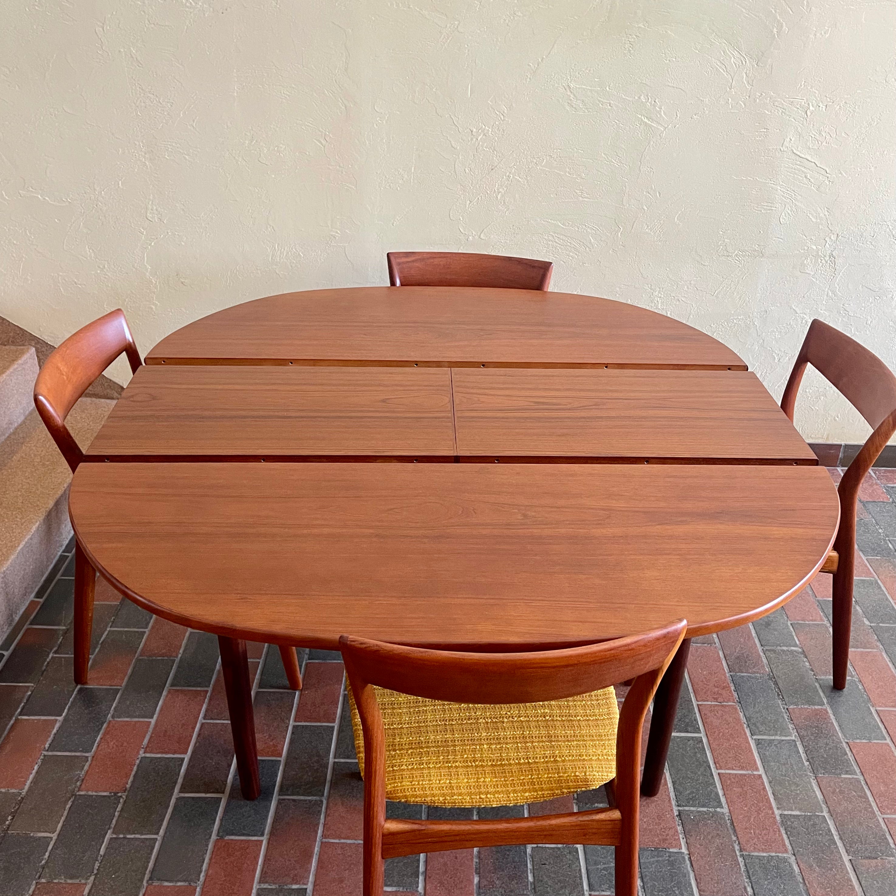 Stamped made in Denmark, the table is unique in that it opens side to side as opposed to end to end. When pulled apart it reveals a fold out butterfly leaf.  When the table is closed it is an oval shape but when open it’s more of a "square with rounded corners" 