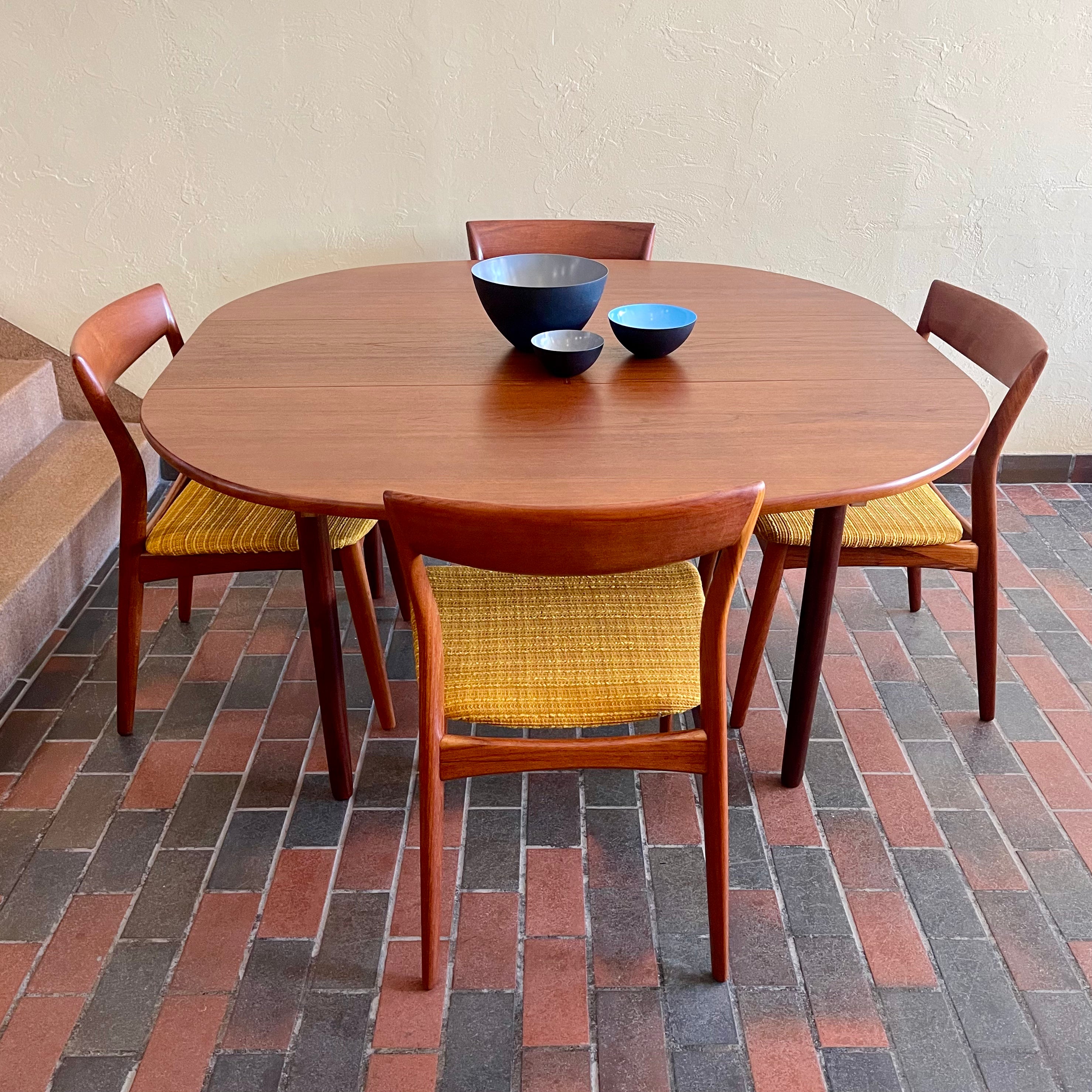 Stamped made in Denmark, the table is unique in that it opens side to side as opposed to end to end. When pulled apart it reveals a fold out butterfly leaf.  When the table is closed it is an oval shape but when open it’s more of a "square with rounded corners" 