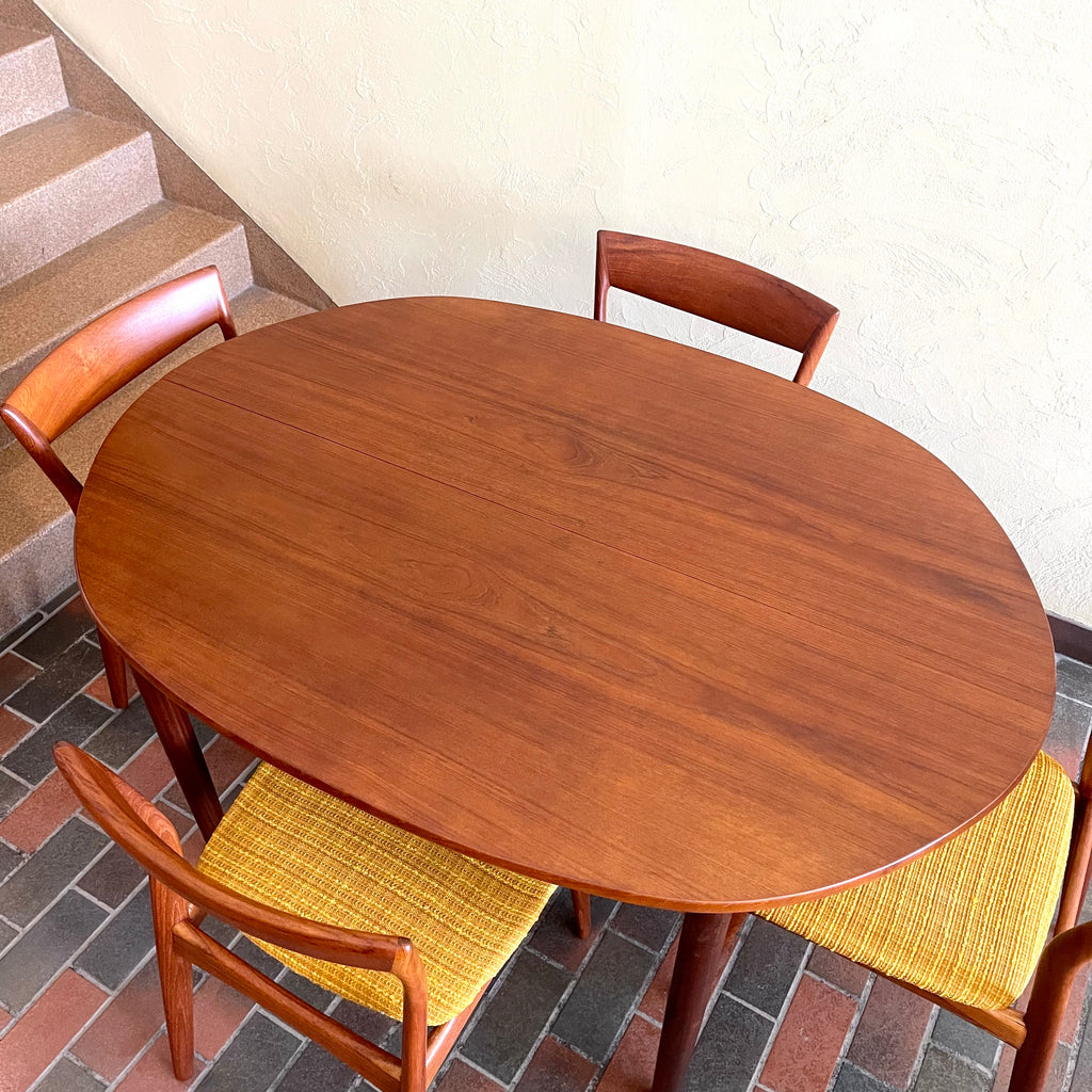 Stamped made in Denmark, the table is unique in that it opens side to side as opposed to end to end. When pulled apart it reveals a fold out butterfly leaf.  When the table is closed it is an oval shape but when open it’s more of a "square with rounded corners" 