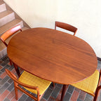 Stamped made in Denmark, the table is unique in that it opens side to side as opposed to end to end. When pulled apart it reveals a fold out butterfly leaf.  When the table is closed it is an oval shape but when open it’s more of a "square with rounded corners" 