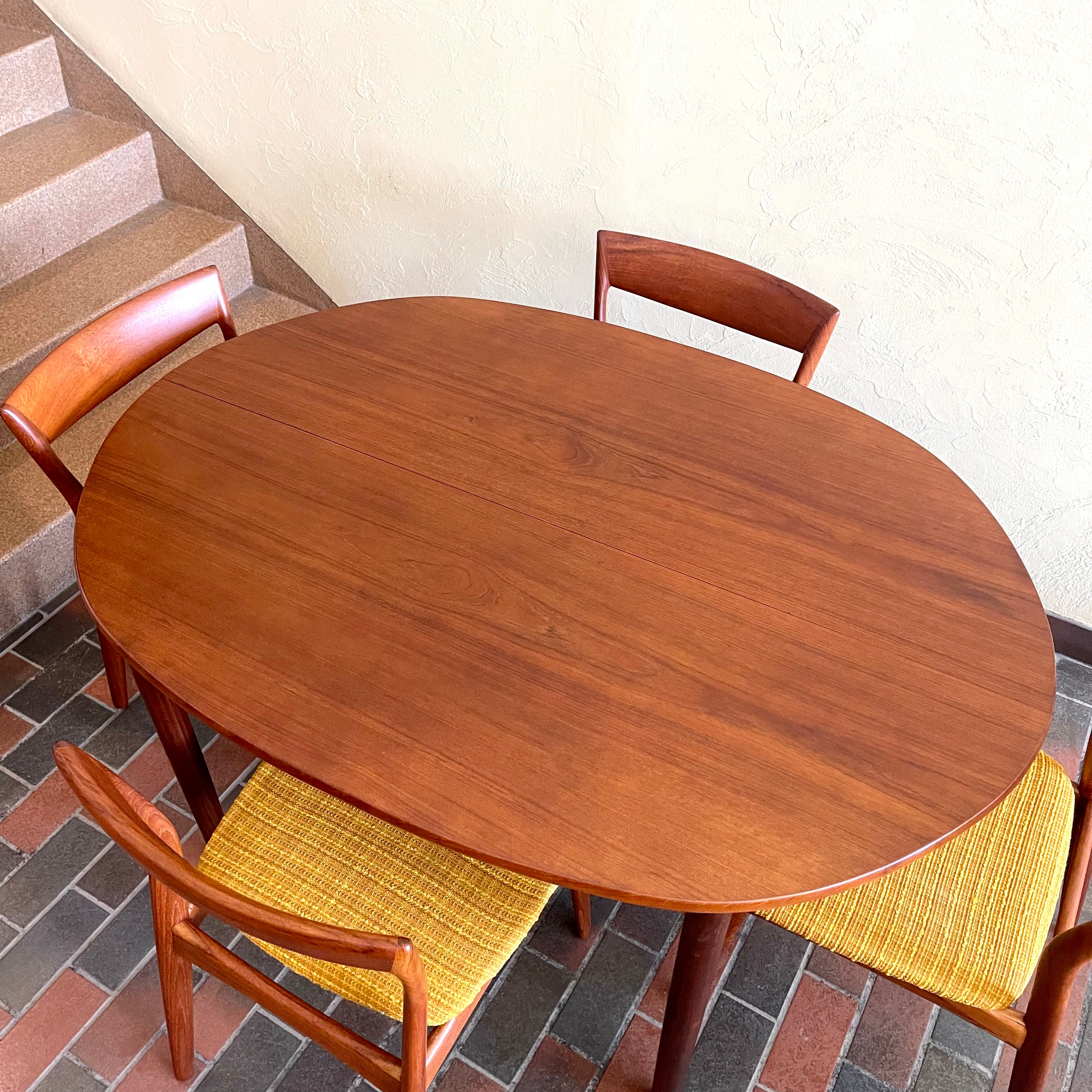 Stamped made in Denmark, the table is unique in that it opens side to side as opposed to end to end. When pulled apart it reveals a fold out butterfly leaf.  When the table is closed it is an oval shape but when open it’s more of a "square with rounded corners" 