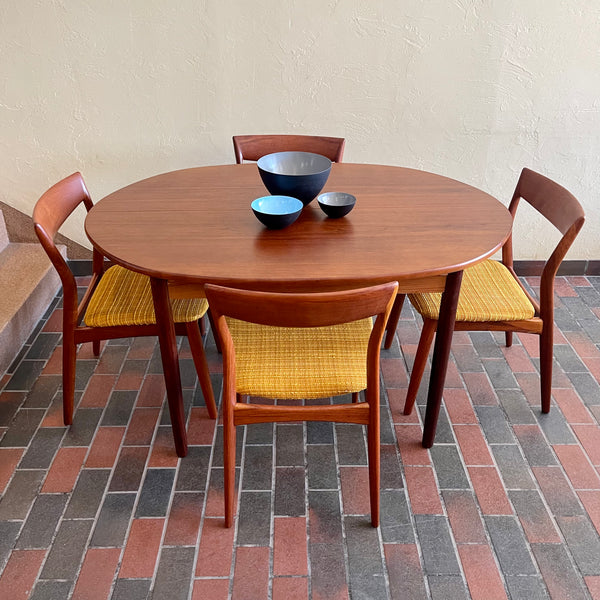 Stamped made in Denmark, the table is unique in that it opens side to side as opposed to end to end. When pulled apart it reveals a fold out butterfly leaf.  When the table is closed it is an oval shape but when open it’s more of a "square with rounded corners" 