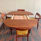 Stamped made in Denmark, the table is unique in that it opens side to side as opposed to end to end. When pulled apart it reveals a fold out butterfly leaf.  When the table is closed it is an oval shape but when open it’s more of a "square with rounded corners" 