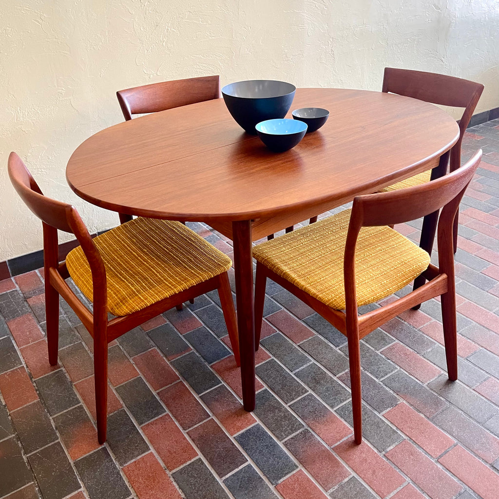 Stamped made in Denmark, the table is unique in that it opens side to side as opposed to end to end. When pulled apart it reveals a fold out butterfly leaf.  When the table is closed it is an oval shape but when open it’s more of a "square with rounded corners" 