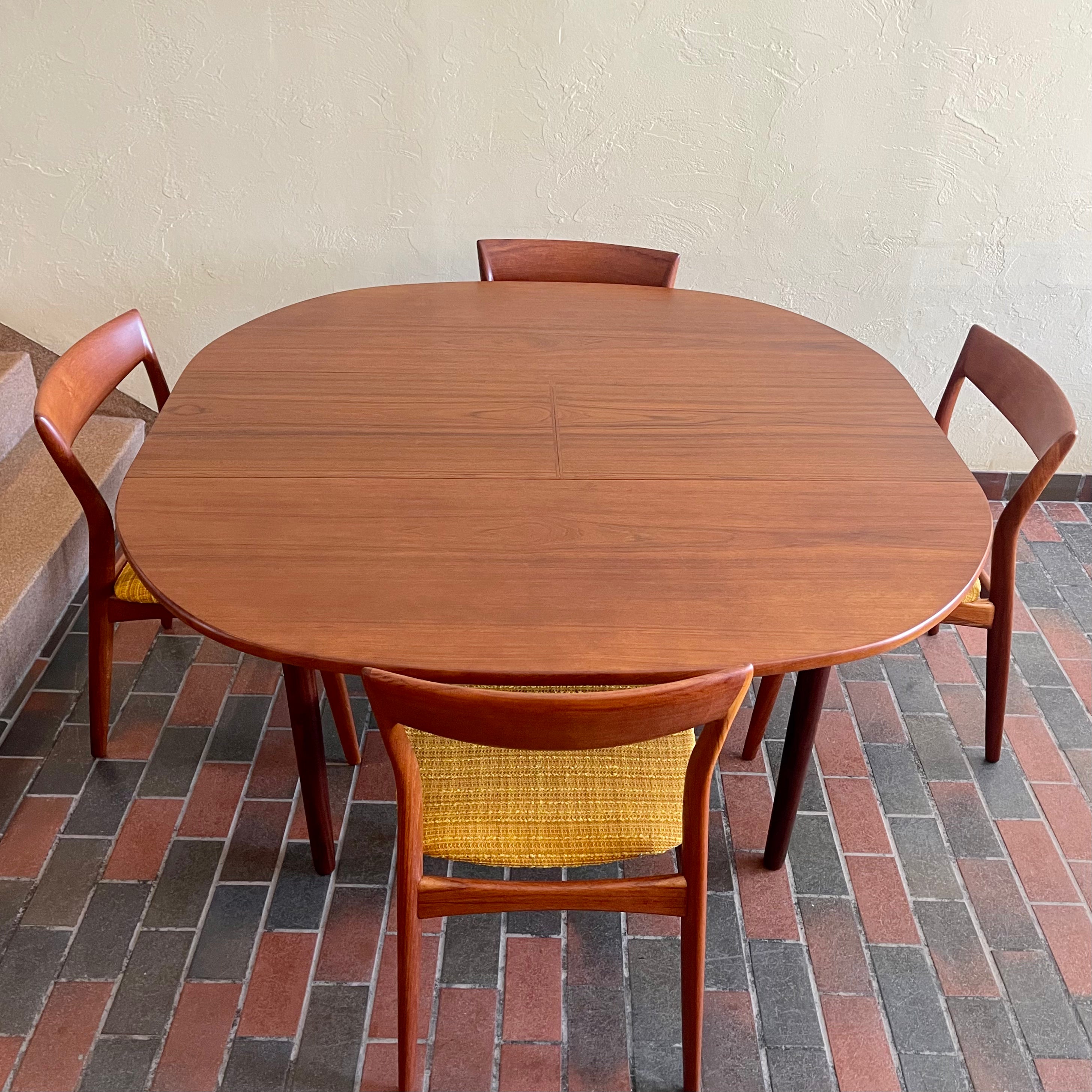 Stamped made in Denmark, the table is unique in that it opens side to side as opposed to end to end. When pulled apart it reveals a fold out butterfly leaf.  When the table is closed it is an oval shape but when open it’s more of a "square with rounded corners" 