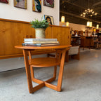 Two-tier teak side table shown with vintage decor