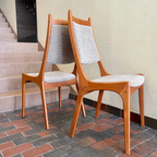 Side view of R. Huber mid-century teak dining chair