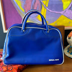 Back view of Vintage PAN AM travel bag with blue body and top handles
