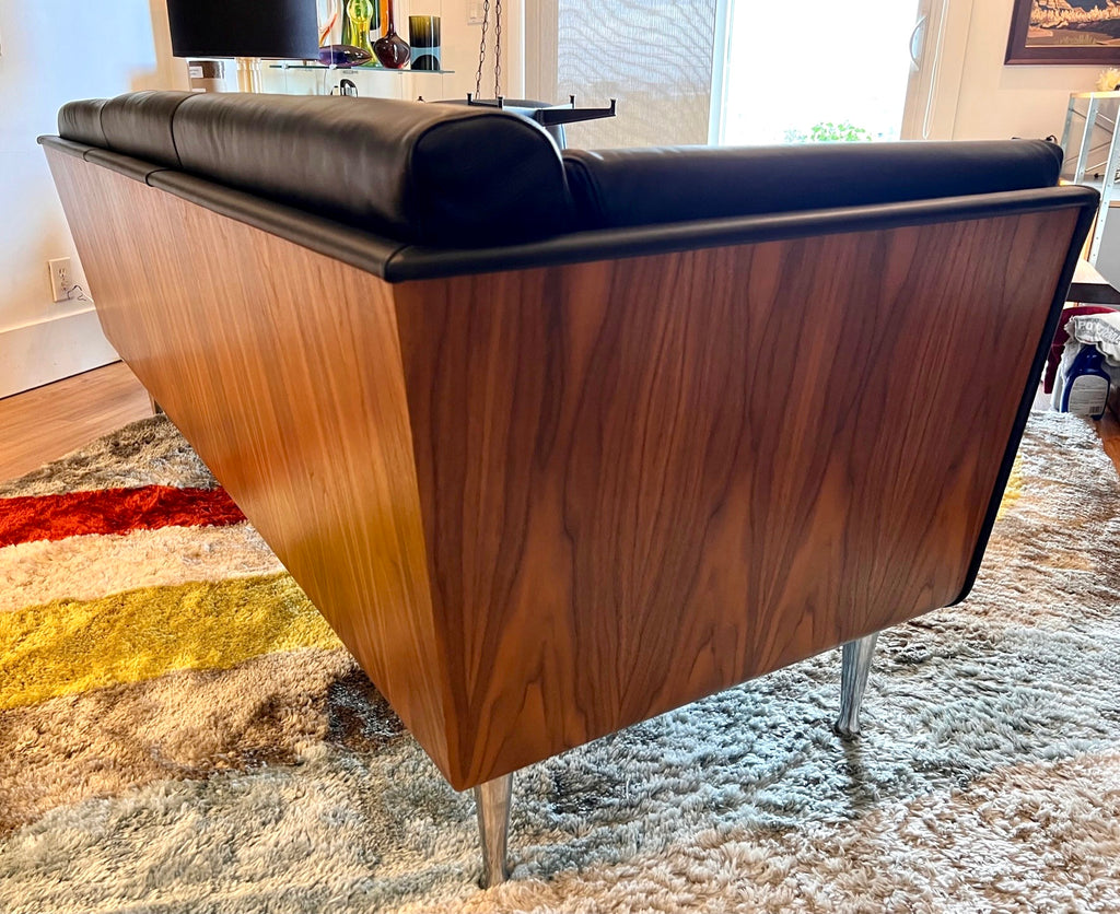Close-up of walnut wrapped exterior on Mark Goetz sofa for Herman Miller