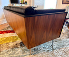 Close-up of walnut wrapped exterior on Mark Goetz sofa for Herman Miller