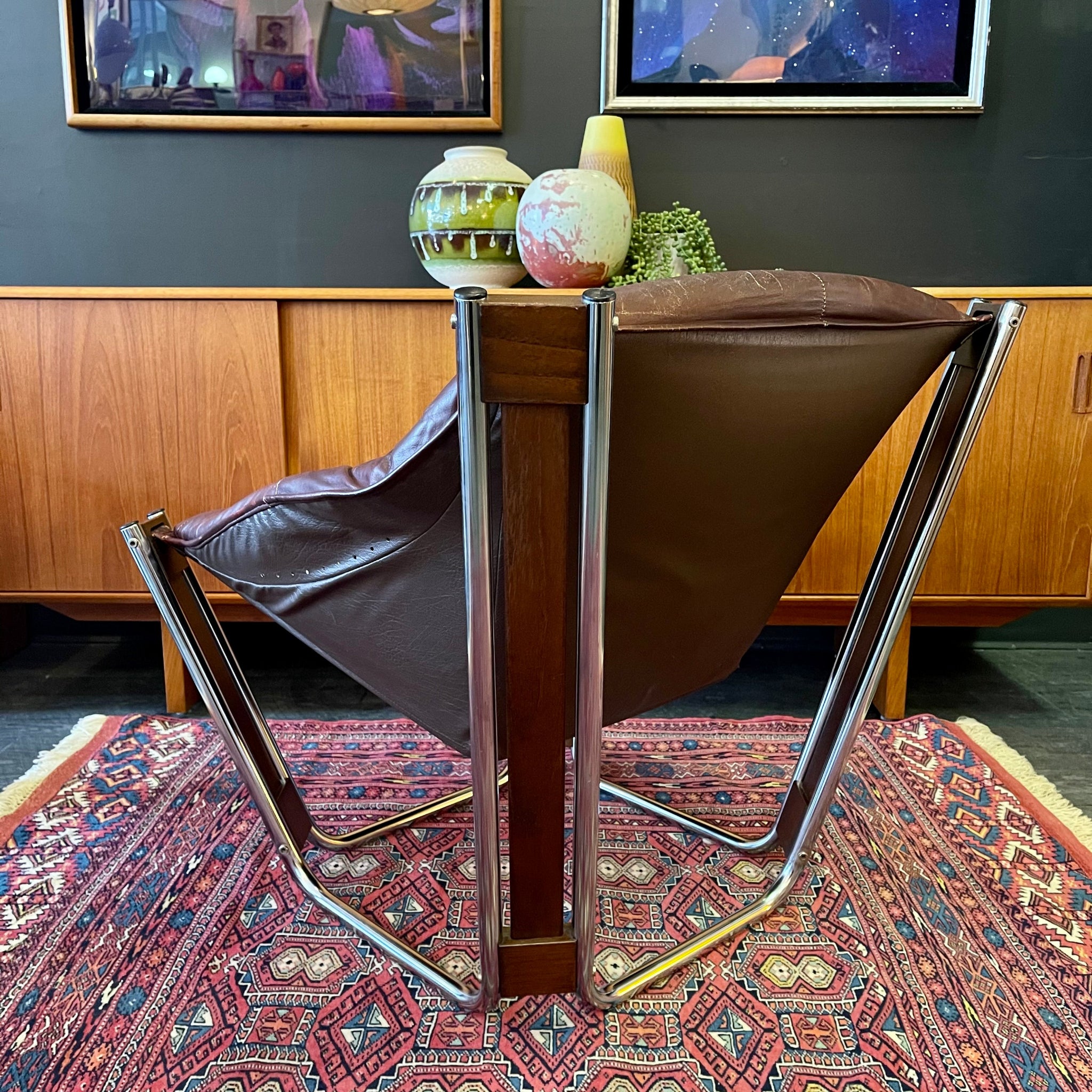 Indian rosewood frame and Chrome and tubular steel detail on Sonic lounge chair