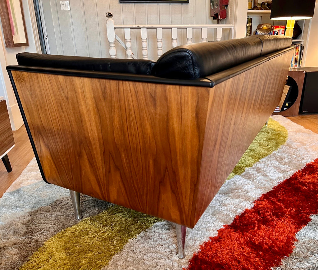 Close-up of walnut wrapped exterior on Mark Goetz sofa for Herman Miller