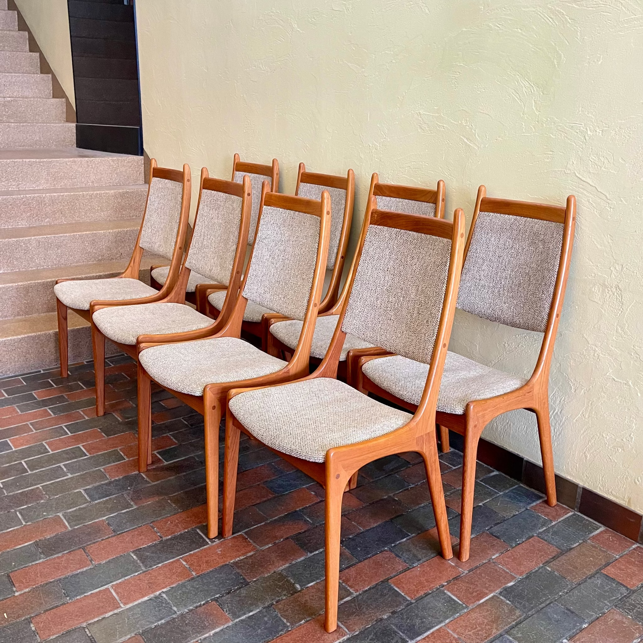 Set of R. Huber teak dining chairs with oatmeal upholstered seats