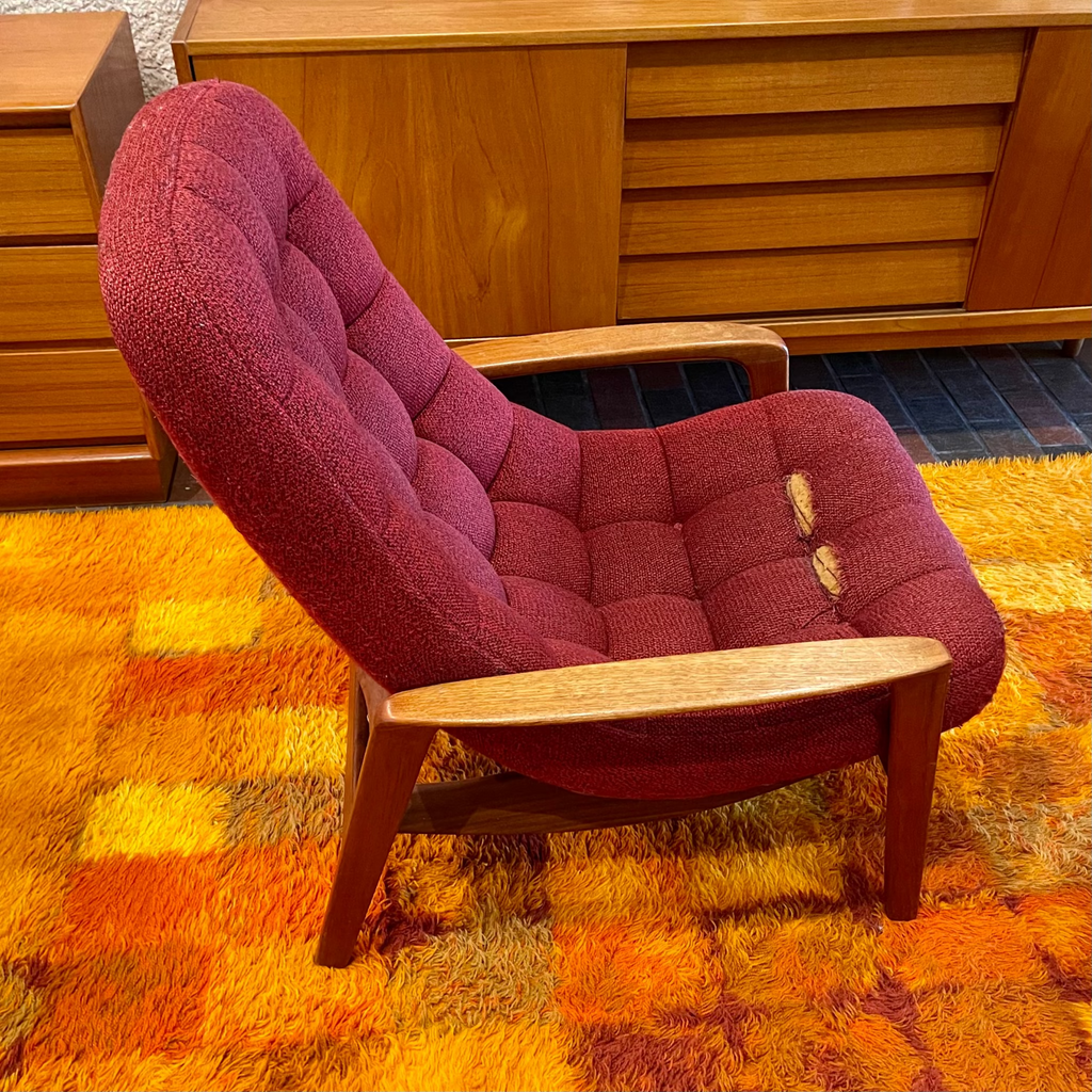 Original upholstery wear on R. Huber scoop lounge chair