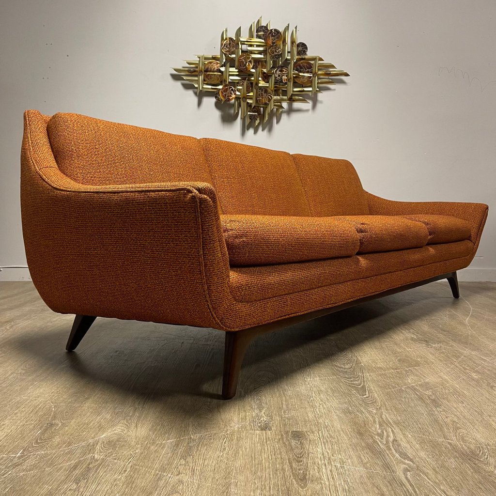 Angled view of House of Braemore atomic style sofa showing original patterned upholstery