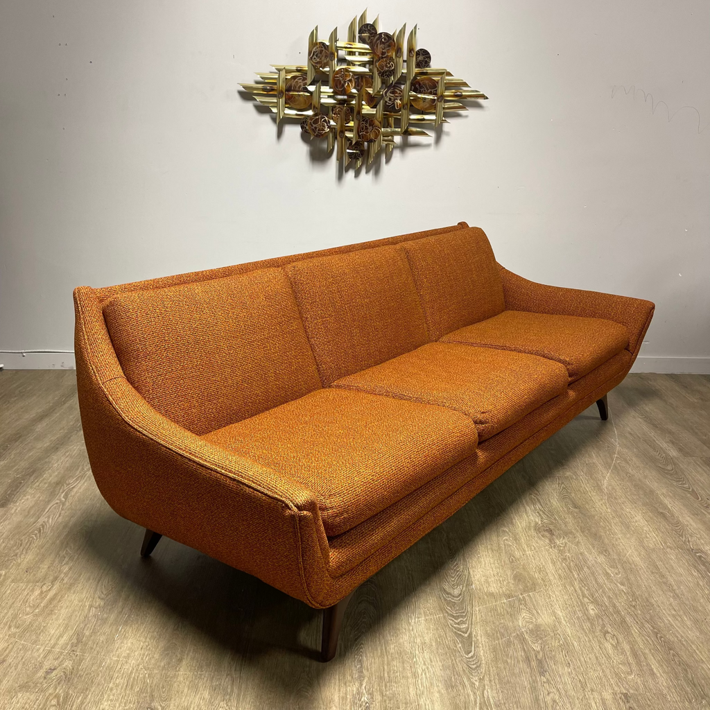 Vintage House of Braemore sofa with burnt orange atomic fabric and mid-century profile