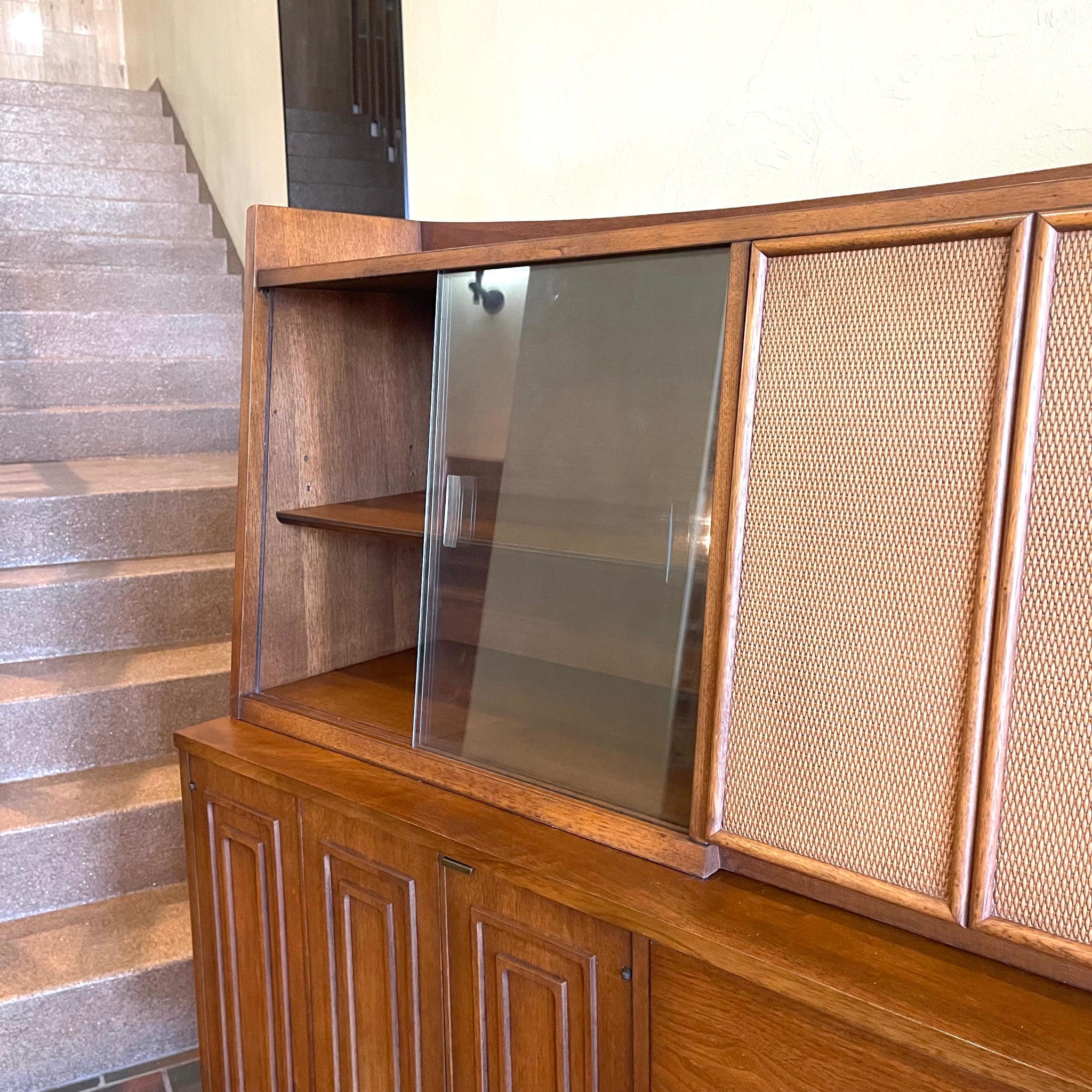 Glass door hutch on Broyhill Premier Sculptra walnut cabinet