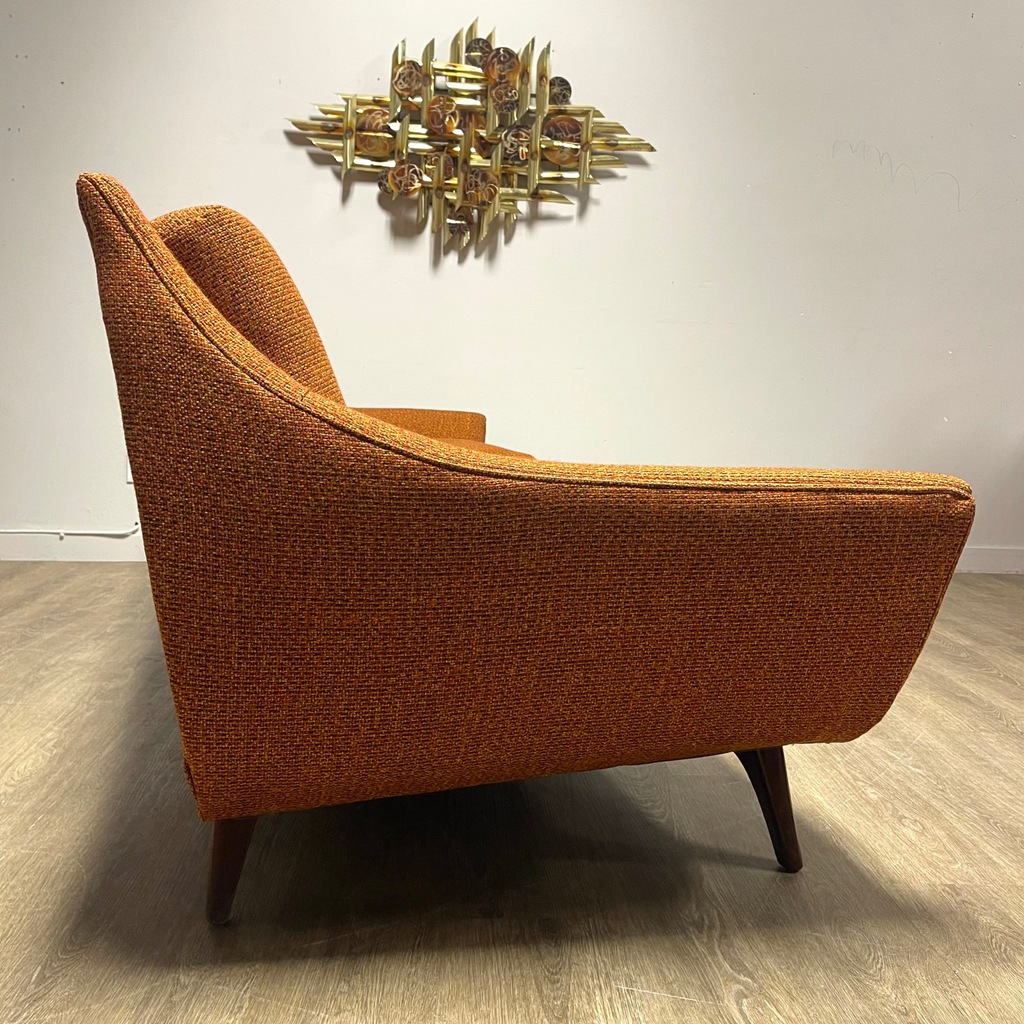 Side view of House of Braemore atomic style sofa showing original patterned upholstery