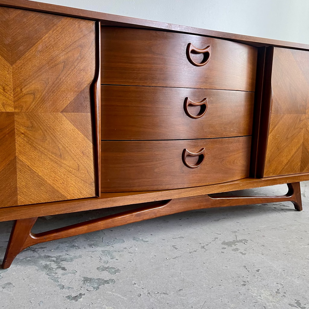 Drawer handle detail on vintage VISCOL walnut dresser