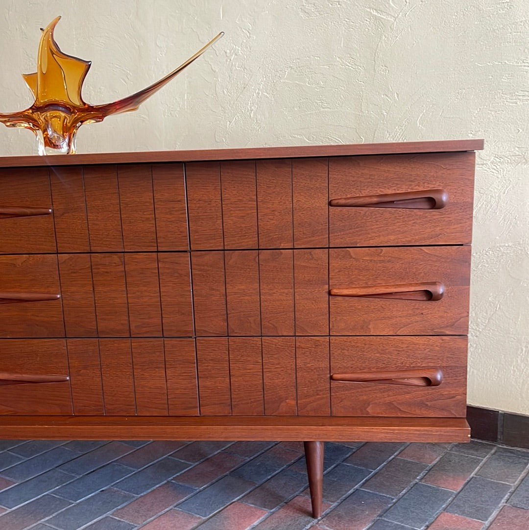 Close-up of Viscol Victoriaville walnut dresser showing sculpted mid-century drawer handles