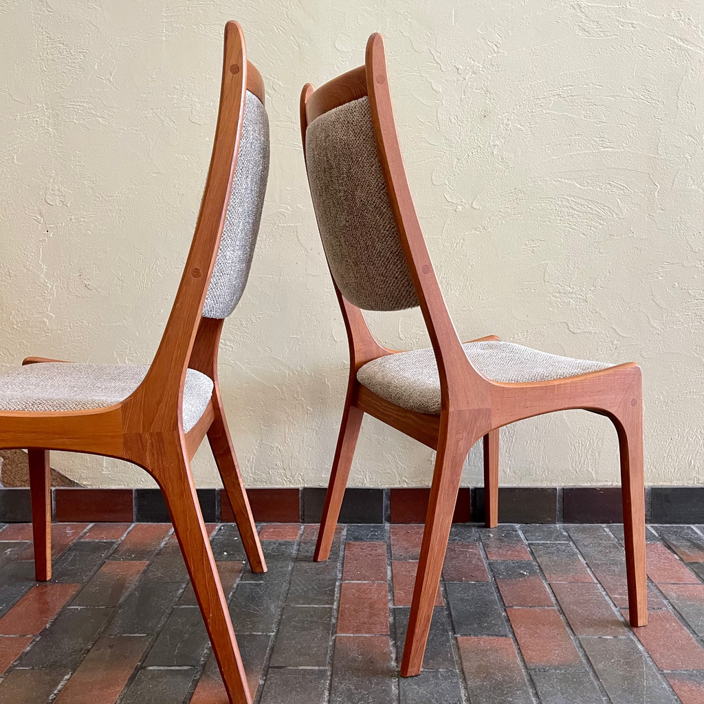Side view of R. Huber mid-century teak dining chairs